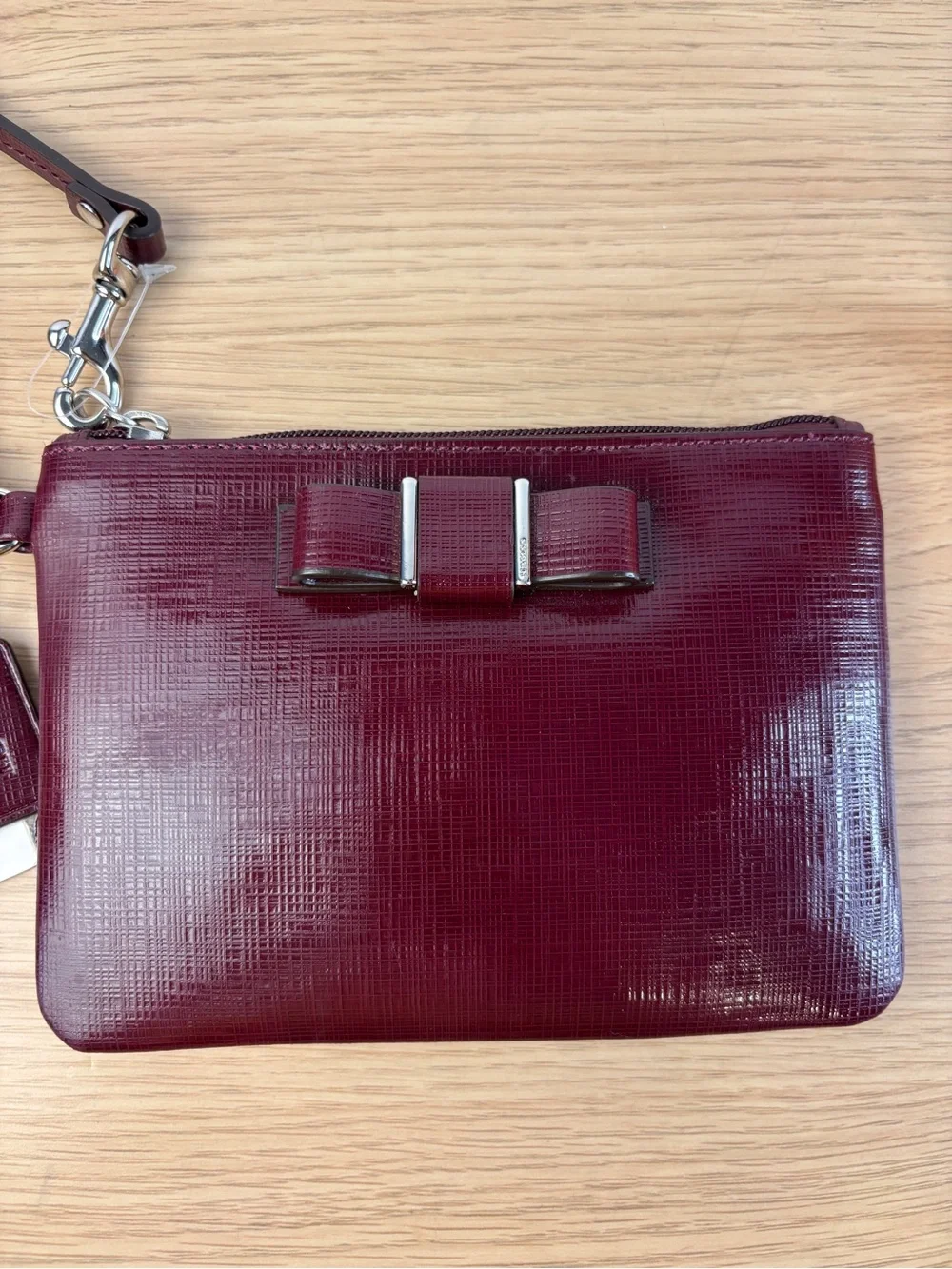 Coach Darcy Patent Leather Bow Small Wristlet in “Sherry” Wine Color NWT